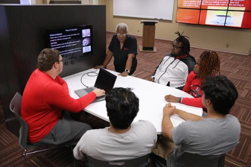 Business Professor teaches students